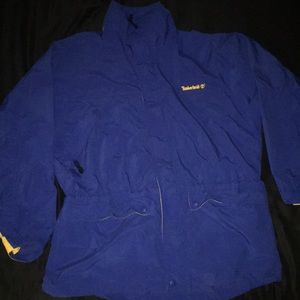 Blue Timberland wind jacket with yellow accents.